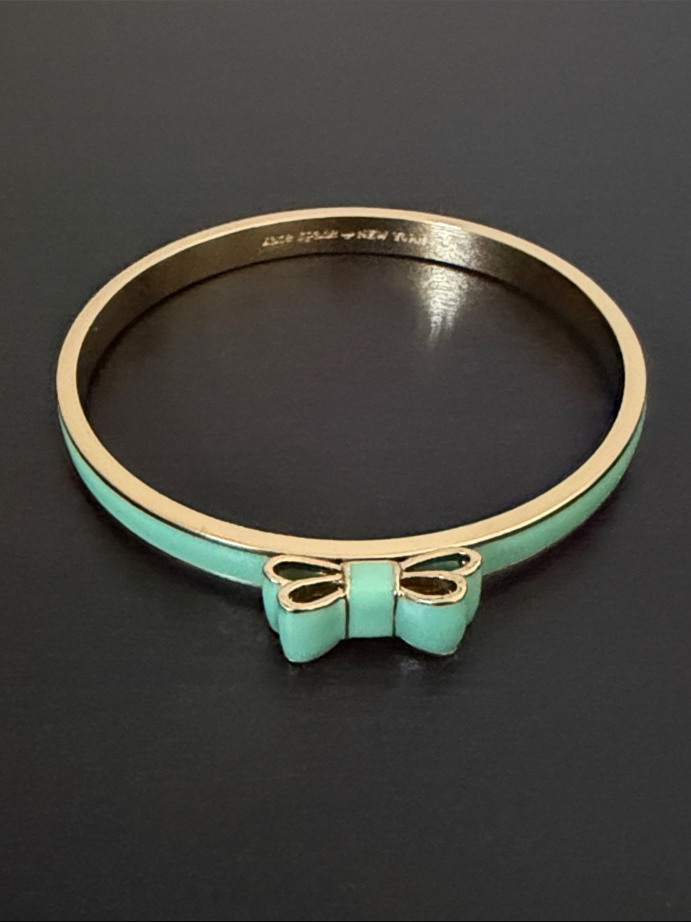 kate spade gold-tone bangle with mint green enamel bow
